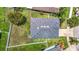 Aerial view of the house showing the roof and surrounding yard at 14371 Edinburgh Moor Dr, Wimauma, FL 33598