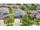 An aerial view showcases this home's backyard with white fencing and surrounding neighborhood at 14371 Edinburgh Moor Dr, Wimauma, FL 33598