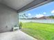 Spacious backyard with a well-maintained lawn and a white privacy fence at 14371 Edinburgh Moor Dr, Wimauma, FL 33598