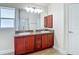 Bathroom features double vanity with granite countertop and shower stall at 14371 Edinburgh Moor Dr, Wimauma, FL 33598