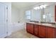 Bathroom features double vanity, garden tub and private toilet at 14371 Edinburgh Moor Dr, Wimauma, FL 33598