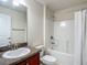 Bathroom features single vanity, toilet and shower/tub combo at 14371 Edinburgh Moor Dr, Wimauma, FL 33598