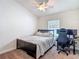 Bedroom featuring a bed, fan and desk at 14371 Edinburgh Moor Dr, Wimauma, FL 33598