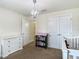 Bedroom featuring a crib, dresser and closet at 14371 Edinburgh Moor Dr, Wimauma, FL 33598
