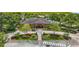 Beautiful community clubhouse with lush landscaping, a paved walkway, and convenient parking at 14371 Edinburgh Moor Dr, Wimauma, FL 33598