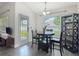 Bright dining space with backyard access, ideal for entertaining at 14371 Edinburgh Moor Dr, Wimauma, FL 33598