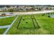 Fenced dog park with play structures, providing a safe and fun area for pets to socialize and exercise at 14371 Edinburgh Moor Dr, Wimauma, FL 33598