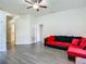 Spacious living room featuring hard floors and bright lighting at 14371 Edinburgh Moor Dr, Wimauma, FL 33598