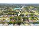 An aerial view of the home's location in a residential neighborhood near a lake at 1510 Patricia Ave, Dunedin, FL 34698