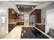 Updated kitchen with wood cabinetry, stainless steel appliances, granite countertops, and a modern vent hood at 1510 Patricia Ave, Dunedin, FL 34698