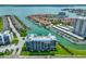 Beautiful aerial view of waterfront condos with boat docks and lush landscaping on the inter-coastal waterway at 1591 Gulf Blvd # 304S, Clearwater Beach, FL 33767
