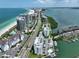 Expansive aerial view of a coastal city with beaches, high-rise buildings, and waterfront homes at 1591 Gulf Blvd # 304S, Clearwater Beach, FL 33767