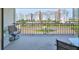 Balcony with seating area and beautiful views of the street and surrounding buildings at 1591 Gulf Blvd # 304S, Clearwater Beach, FL 33767