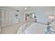 Bright bedroom features a comfortable bed and dresser with decor and carpeted flooring at 1591 Gulf Blvd # 304S, Clearwater Beach, FL 33767