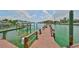 Beautiful dock surrounded by water, offering access for boating and scenic views at 1591 Gulf Blvd # 304S, Clearwater Beach, FL 33767
