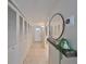 Hallway featuring built-in storage, tile floors, and a decorative mirror at 1591 Gulf Blvd # 304S, Clearwater Beach, FL 33767
