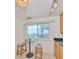 A breakfast nook with stools, a table, and a view of the inter-coastal waterway at 1591 Gulf Blvd # 304S, Clearwater Beach, FL 33767