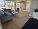 Bright living room features tile floors, a comfortable gray sectional sofa, and an abundance of natural light at 1591 Gulf Blvd # 304S, Clearwater Beach, FL 33767