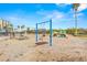 Community playground featuring swings, slide, and various play structures in a fenced-in area at 1591 Gulf Blvd # 304S, Clearwater Beach, FL 33767