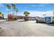 Exterior view of the Shoppes at Sand Key, showcasing a variety of shops and restaurants with ample parking at 1591 Gulf Blvd # 304S, Clearwater Beach, FL 33767