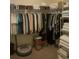 Walk-in closet with ample storage featuring rods, shelves, and organized clothing at 1607 Alexander Crossing Way, Sun City Center, FL 33573