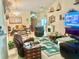 Cozy living room featuring comfortable seating, a fireplace, and a TV for relaxation at 1607 Alexander Crossing Way, Sun City Center, FL 33573