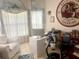 Bright office space with large windows, perfect for work or study with exercise equipment at 1607 Alexander Crossing Way, Sun City Center, FL 33573