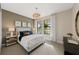 Inviting bedroom with plush carpeting, large windows and scenic views at 16427 Sapphire Point Dr, Lakewood Ranch, FL 34211