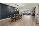 Open dining area with a long table and view of the living room at 16427 Sapphire Point Dr, Lakewood Ranch, FL 34211