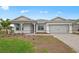 Charming one-story home with a two-car garage and a well-maintained front yard at 16427 Sapphire Point Dr, Lakewood Ranch, FL 34211