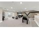 Upstairs game room with a foosball table, TV, comfortable seating, and great natural light at 16427 Sapphire Point Dr, Lakewood Ranch, FL 34211