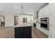 Bright kitchen featuring stainless steel appliances, a large island, and stylish pendant lighting at 16427 Sapphire Point Dr, Lakewood Ranch, FL 34211