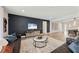 Spacious living room with modern furnishings and a stylish accent wall at 16427 Sapphire Point Dr, Lakewood Ranch, FL 34211
