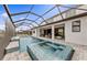 A private screened-in pool and spa with outdoor seating, perfect for relaxation at 16427 Sapphire Point Dr, Lakewood Ranch, FL 34211