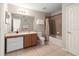 Bathroom featuring vanity with storage, tiled floors and a shower-tub combination at 17509 Queensland St, Land O Lakes, FL 34638