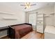 Bedroom featuring a twin bed, hardwood flooring, and ample natural light at 17509 Queensland St, Land O Lakes, FL 34638