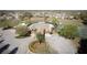 Aerial view of community pool, tennis court and gathering areas, a great spot for relaxation and fun at 17509 Queensland St, Land O Lakes, FL 34638
