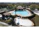 Aerial of community pool and splash pad, providing recreational opportunities for residents at 17509 Queensland St, Land O Lakes, FL 34638