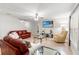 Comfortable living room with tile flooring, ceiling fan, and natural light at 17509 Queensland St, Land O Lakes, FL 34638