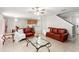 Open-concept living space with views of dining area, and staircase at 17509 Queensland St, Land O Lakes, FL 34638