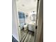 The modern bathroom showcases a round mirror, steel rack, a stylish vanity, and an elegant shower curtain at 19743 Ellendale Dr, Land O Lakes, FL 34638
