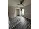 Bedroom with wood-style floors and a ceiling fan at 19743 Ellendale Dr, Land O Lakes, FL 34638