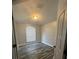 Bedroom features wood-look flooring, a window for natural light, and a neutral color palette at 19743 Ellendale Dr, Land O Lakes, FL 34638