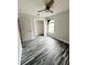 Cozy bedroom with hardwood floors, and a closet, bathed in soft, natural light at 19743 Ellendale Dr, Land O Lakes, FL 34638