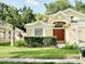 Charming home featuring a well-maintained lawn, mature landscaping, and a welcoming front entrance at 19743 Ellendale Dr, Land O Lakes, FL 34638