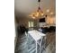 Open living room showcasing hardwood floors, modern lighting, and ample seating at 19743 Ellendale Dr, Land O Lakes, FL 34638