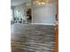 Bright open-concept living room with wood floors and abundant natural light at 19743 Ellendale Dr, Land O Lakes, FL 34638