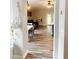 Open concept living space with stylish gray wood floors connecting the dining and living areas at 19743 Ellendale Dr, Land O Lakes, FL 34638
