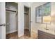 Closet interior with built-in shelving and rods for optimal storage solutions, plus natural light at 201 W Alva St, Tampa, FL 33603