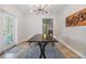 Dining room features a unique light fixture and dark wood table with seating for four at 201 W Alva St, Tampa, FL 33603